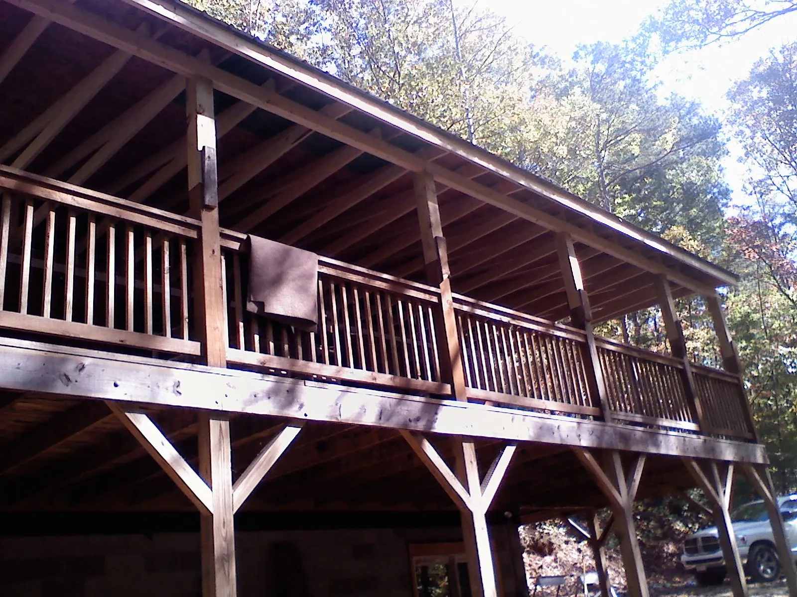 Timber framing under a new elevated porch and deck — Roof Leak Repair in Caddo Mills by Roofing Brothers